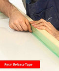 Person applying green heavy duty polyester tape with silicone adhesive for high temperature bake ready jobs no residue.