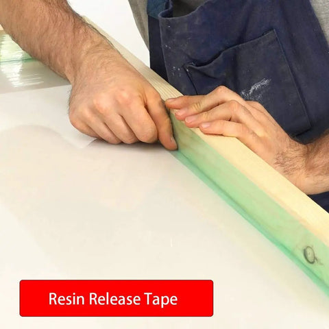 Person applying green heavy duty polyester tape with silicone adhesive for high temperature bake ready jobs no residue.