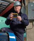 Technician using PTi120 Pocket Thermal Imager For Quick Infrared Inspections And Temperature Scans On The Go in industrial setting