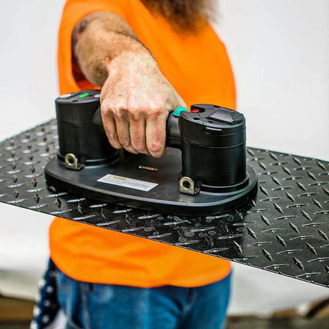 Portable Electric Vacuum Suction Cup Lifter For Wood Tile Marble Drywall Heavy Duty Hand Tool With Two Batteries Moves Three Seventy Five Pounds No Sweat Construction Hauling lifting a textured metal panel.