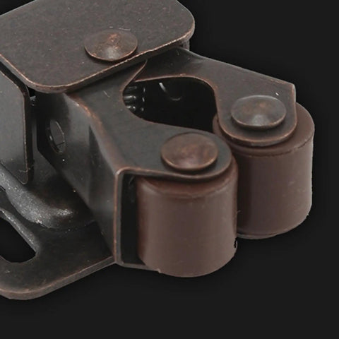 Close-up of brown metal Roller Catch Set 10 Pack Double Roller Door Latch For Cabinets Drawers And Closets No Sweat Install