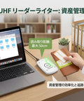 UHF RFID Reader And Writer With Up To 50 Cm Read Range And Keyboard Emulation For Plug And Play Data Entry On Windows Or Linux ISO 18000 6C EPC Gen 2 Compliant in use, connected to a laptop.