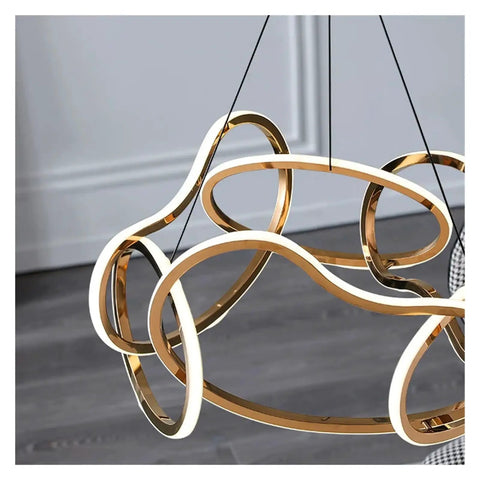 Close-up of Modern Stainless Steel Creative LED Pendant Lamp, luxury minimalist design with gold accents, ideal for decor.