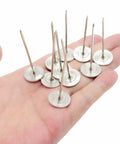 Premium Upholstery Nails And Long Furniture Tacks With Slick Silver Flat Heads For Sofa Restorations And Headboard Builds Super Smooth Finish Zero Hassle DIY Project Hardware Pack Of Ten held in a hand.