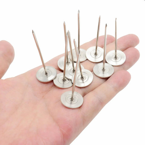 Premium Upholstery Nails And Long Furniture Tacks With Slick Silver Flat Heads For Sofa Restorations And Headboard Builds Super Smooth Finish Zero Hassle DIY Project Hardware Pack Of Ten held in a hand.