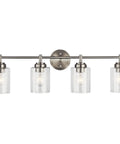 Winslow 30 Inch Vanity Light In Brushed Nickel Four Light Clear Seeded Glass Bath Fixture displayed front view softly glowing.