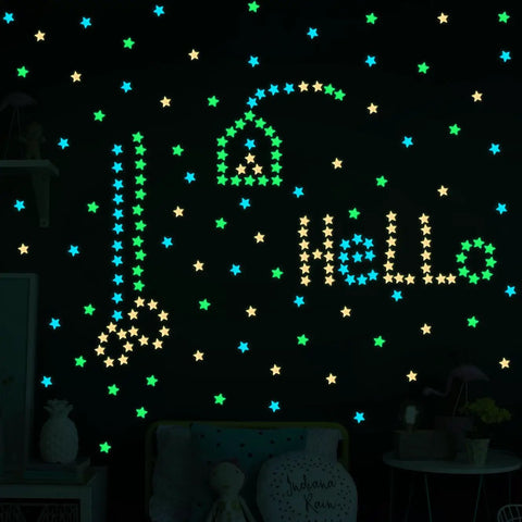 Glow In The Dark Luminous Star Wall Decals Set 100 Multicolor Pieces For Kids Room Nursery And Ceiling Decor Easy Peel And Stick Lit Night Sky Glow In The Dark Wall Stickers For Bedroom showing stars spelling 'Hello'.