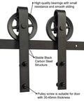 Black Steel Sliding Barn Door Hardware Kit With Heavy Duty Big Rollers for 5Ft To 9.6Ft Track Systems, carbon steel structure close-up.