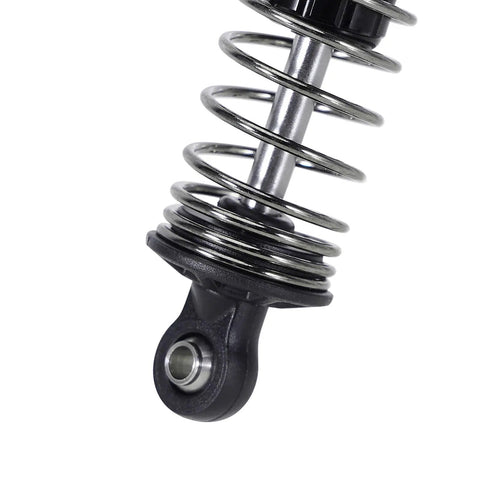 Close-up of 59mm aluminum oil shock with adjustable damping for Mojave Typhon Granite GROM RC cars, showing threaded body and nylon rod end.