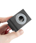 12V DC Solenoid Coil 22W With Dual Wire Leads For Hydraulic Power Units And Lift Dump Equipment, held showing front view