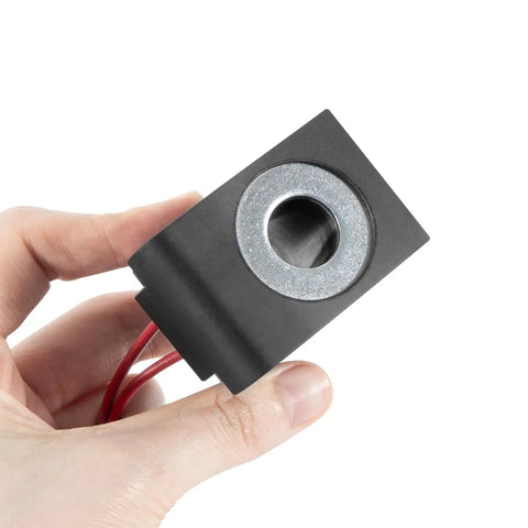 12V DC Solenoid Coil 22W With Dual Wire Leads For Hydraulic Power Units And Lift Dump Equipment, held showing front view