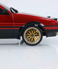 Close-up of One Eighteen Scale RC Drift Car With Gyro Stabilization In Vintage Red showing gold wheels and detailed side view