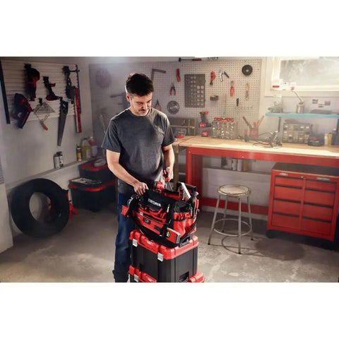 Man organizing tools in VersaStack Zippered Tool Bag With 31 Pocket Organizer Built For Heavy Duty Hauling Durable 1680 Denier Fabric