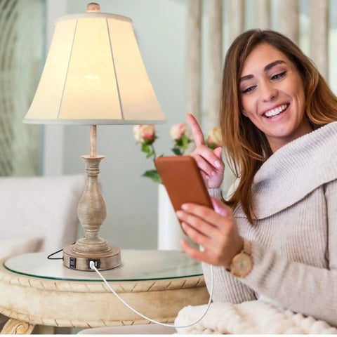 Cozy Farmhouse Style Table Lamp With Touch Control And 3 Way Dimming next to woman using phone on beige sofa