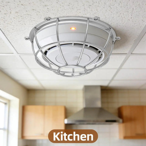 Heavy Duty Metal Detector Guard Cover And Fire Alarm Protector With Tool Less Quick Mount For Sprinkler Heads And Smoke Sensors In Homes Offices Hotels Garages And Commercial Buildings Built Tough To Keep Things Secure mounted in a kitchen ceiling.