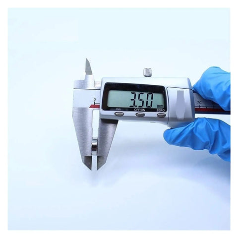 Measuring tool gauging a miniature ball bearing from the Miniature Ball Bearing Kit Ten Pack MR128ZZ ABEC Five Chrome Steel 8x12x3.5mm High Precision Bearings for DIY Projects