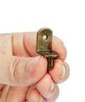 Premium L Shaped Cabinet Shelf Clips With 6mm Holes 40 Pack Bronze Metal Support Peg held in hand, showing detail of peg design.