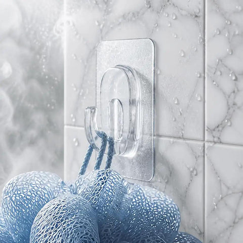Upgraded Heavy Duty Nano Acrylic Gel Small Clear Adhesive Hooks 36 Pack Damage Free Mini Wall Hangers holding a blue loofah on tiled wall.