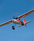 BGFT 1300mm 6 Channel RC Airplane With Vector Flight Stabilization System RTF flying, red and white design in clear blue sky.