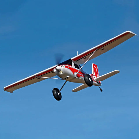 BGFT 1300mm 6 Channel RC Airplane With Vector Flight Stabilization System RTF flying, red and white design in clear blue sky.