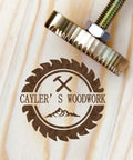 Branding Iron Kit for Wood and Leather With Copper Stamp Mold and Handy Handle imprinting logo on wooden surface.