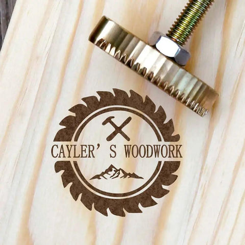 Branding Iron Kit for Wood and Leather With Copper Stamp Mold and Handy Handle imprinting logo on wooden surface.