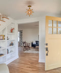 Brushed Gold Moravian Star Ceiling Light With Seeded Glass Semi Flush Mount For Foyer And Hallway in a modern entryway
