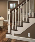 Elegant staircase in modern living room with dark wood steps and white spindles, featuring Bluetooth Enabled 4.0 Smart Internet Access Bridge for Halo Home System Hook It Up With Alexa And Google Assistant, Control Halo Lights Remotely From Anywhere, Easy Setup Remote Hub White.