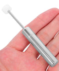 Hand holding a hydraulic piston from the Trash Can Lid Support Hinge Soft Close Damper Kit 6 Pack Hydraulic Piston Replacement for Kitchen and Office Quiet Noise Reducing Lid Closure for Busy Homes and Crazy Busy Spaces.