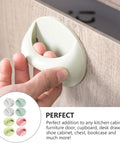 Hand applying 8 Pack Self Adhesive Wardrobe Handles For Cabinets And Drawers No Drill Punch Free Easy Stick On Door Knobs with colorful surface