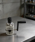 Awesome Plastic Hand Crank Manual Wire Stripper For Copper And Aluminum Cables Features Adjustable 2 To 20Mm Range on a metal surface.