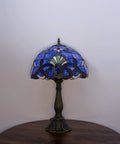 Blue Tiffany Style Table Lamp with handcrafted stained glass and bronze finish on a wooden nightstand, 18 inch tall UL certified.