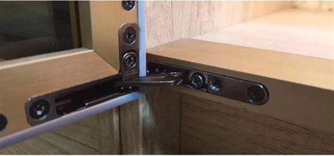 Tough As Nails Heavy Duty Invisible Aluminum Cabinet Door Hinges featuring hydraulic cushion mounted in wooden cabinet.