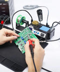 Using Pro Grade 110W Soldering Station Kit With 3 Preset Channels And Sleep Mode, LED Magnifier, for circuit board repair.