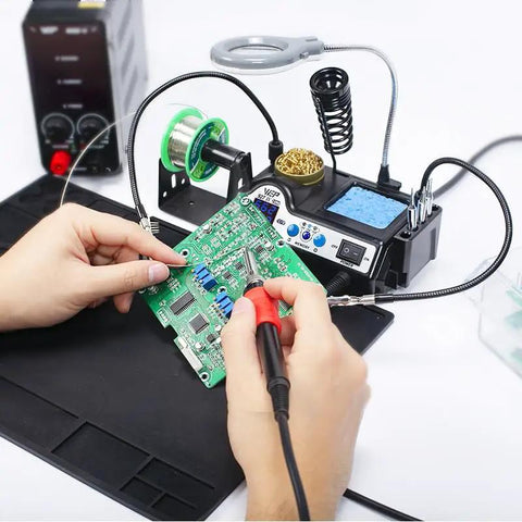 Using Pro Grade 110W Soldering Station Kit With 3 Preset Channels And Sleep Mode, LED Magnifier, for circuit board repair.