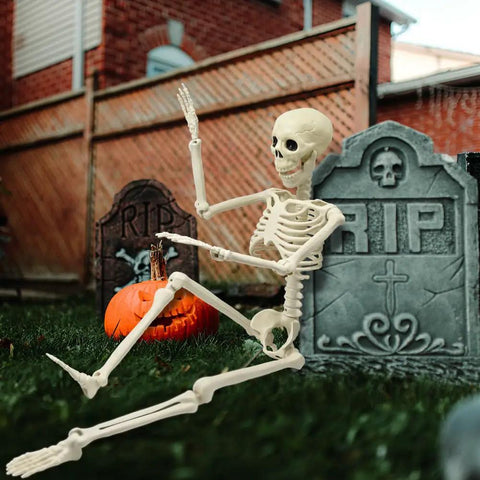 36 Inch Full Body Skeleton Prop With Movable Joints Realistic Plastic Bones for Halloween decor in spooky graveyard setup