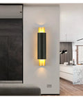 Sleek Black Wall Lamp With E27 Socket For Living Room TV Wall And Entryway Glare Free Indoor Sconce mounted on white wall.