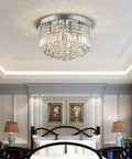 Modern K9 Crystal Raindrop Chandelier Lighting Flush Mount Ceiling Fixture For Dining Room Living Room Bedroom And Bathroom, Energy Saving LED Ready, Requires 9 E12 LED Bulbs Not Included, 11 Inch High By 20 Inch Wide in bedroom setting.