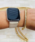 Top Shelf 8mm Gold Disc Brass Spacer Beads Featuring Gleaming 14K Gold Plated Finish on wrist with smartwatch.