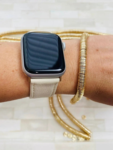 Top Shelf 8mm Gold Disc Brass Spacer Beads Featuring Gleaming 14K Gold Plated Finish on wrist with smartwatch.