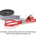 Self Adhesive Cable Management Hoop With Sticky Wire Organizer Keeps Your Desk Slick And Tidy Game Changer Tear Off Nylon Cord Wrap Kit For Home Office In Black with red cables.