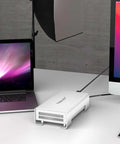 Grab This Top-Shelf Aluminum U.2 NVMe SSD Enclosure USB4 V2 displayed next to laptop and desktop on a desk.