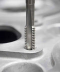 Close-up of Left Hand M10 X 1.0 Tap And Die Set High Speed Steel Threading Kit in reverse thread application