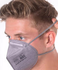 Man wearing N95 Disposable Respirator Mask Made In USA Super Comfy Fit Breathable Skin Friendly Nonwoven Fabric NIOSH Approved