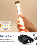 Hand holding 12-inch strip from Under Cabinet Lighting Kit With 6 Pack 12 Inch LED Strips, Plug In Dimmable Tunable White 3000K-6000K, with adapter