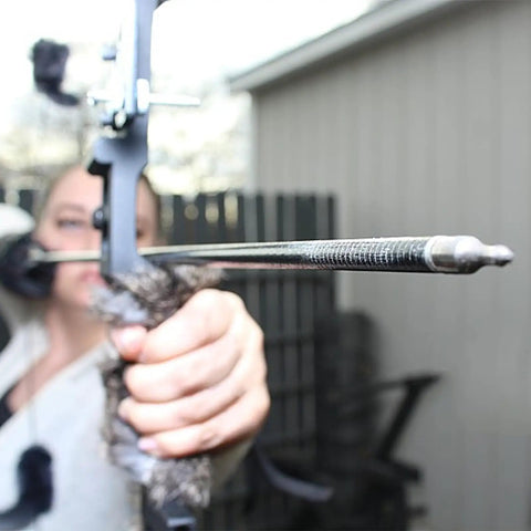 Person aiming a bow with an arrow fitted with Aluminum.244 Arrow Inserts For Carbon Arrows 6.2mm Screw In 100 Grain Field Points Tips Archery Gear
