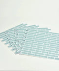 Sea Glass Peel And Stick Backsplash Tiles Blue 10.5 Inch By 10.5 Inch Four Panels neatly stacked on white surface.