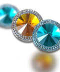 Colorful decorative accents featuring sparkling blue and gold stones set in circles, ideal for unique wall decor.