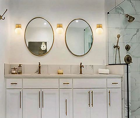 Gold Globe Wall Sconces Set of Two, Dope Brass Modern Vanity Lights With Milky White Glass Shades in elegant bathroom setup