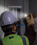 Worker uses Rechargeable 3 In 1 LED Flashlight With Spotlight Floodlight And Red LEDs 1000 Lumens while inspecting electrical panel.